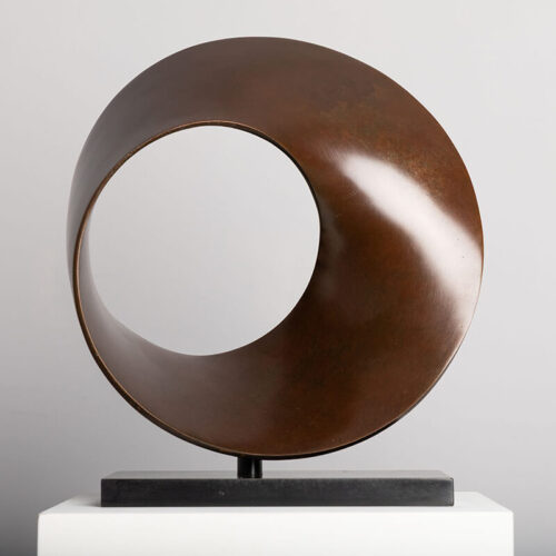 Limited edition bronze Continuum sculpture by James Parker inspired by a Möbius loop, shown in a gallery setting