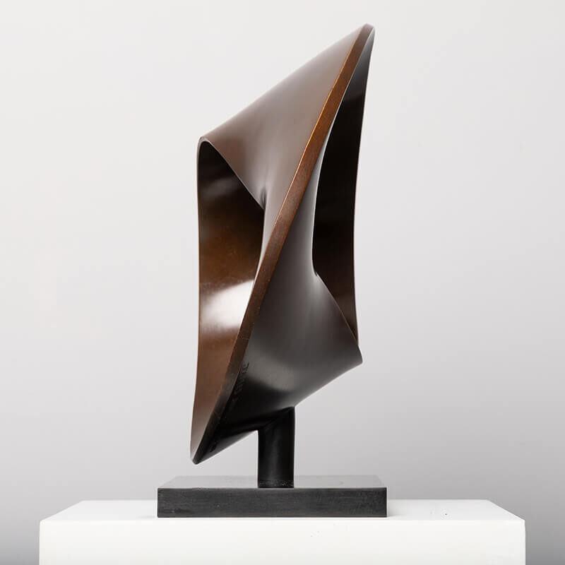 Side perspective of bronze Continuum sculpture by James Parker emphasising twisted Möbius geometry