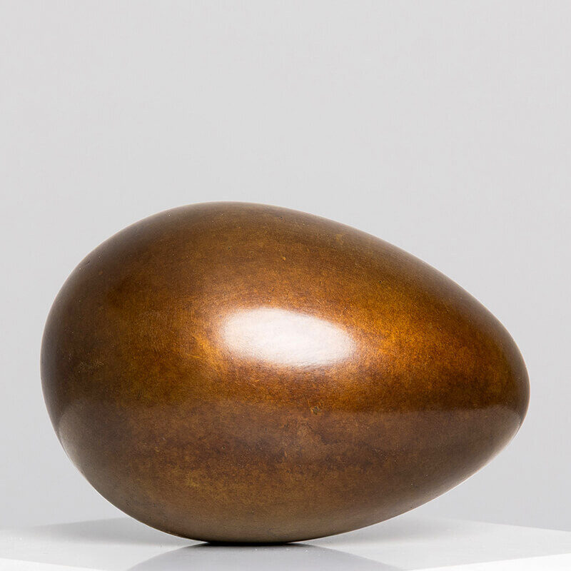 Side view of limited edition bronze Creation egg sculpture by James Parker