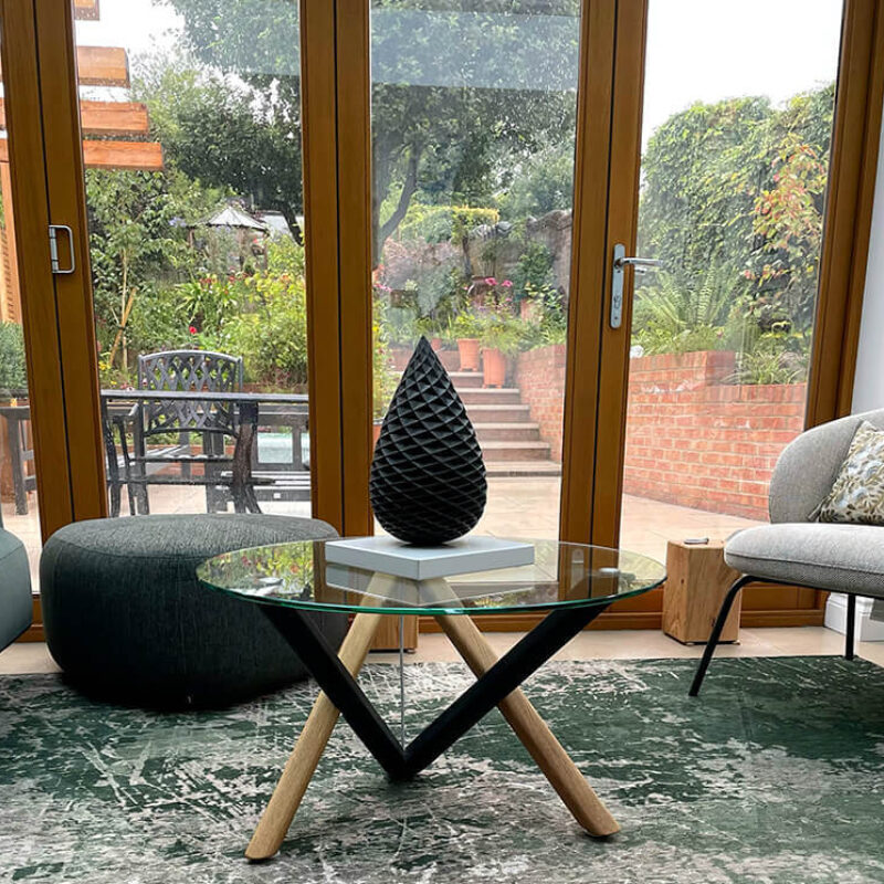 30cm limited edition bronze pine cone sculpture by James Parker displayed in a contemporary interior