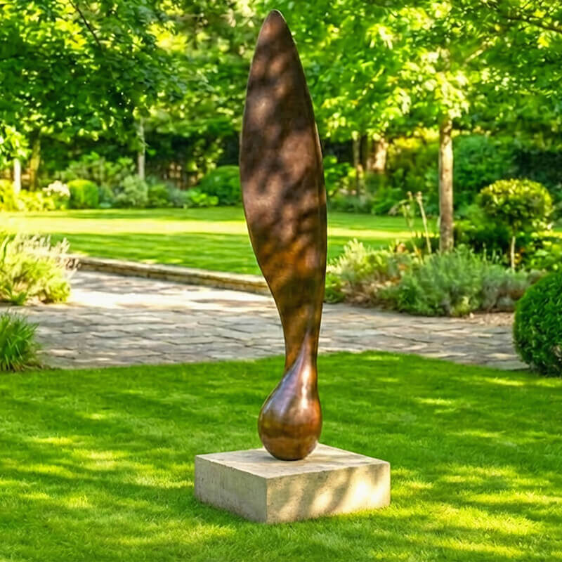Eight-foot Sycamore Seed bronze sculpture by James Parker positioned on a stone base in a landscaped garden