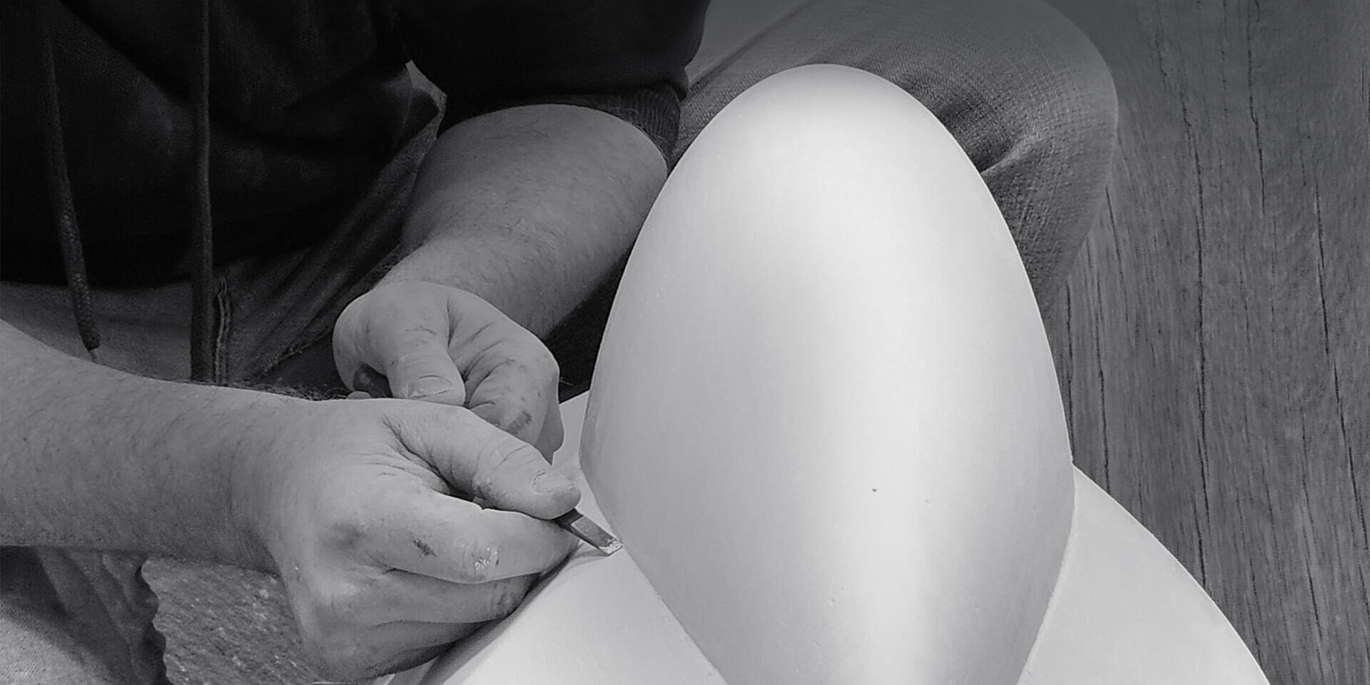 James Parker refining a plaster pattern in his workshop, preparing a sculpture for bronze casting.