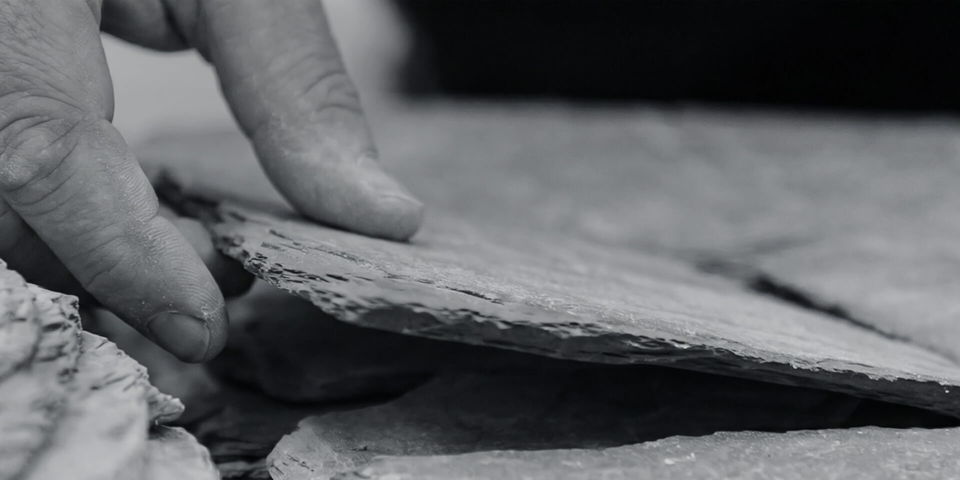 James parker hand placing slate layer stacked sculpture