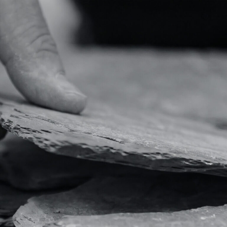 James parker hand placing slate layer stacked sculpture