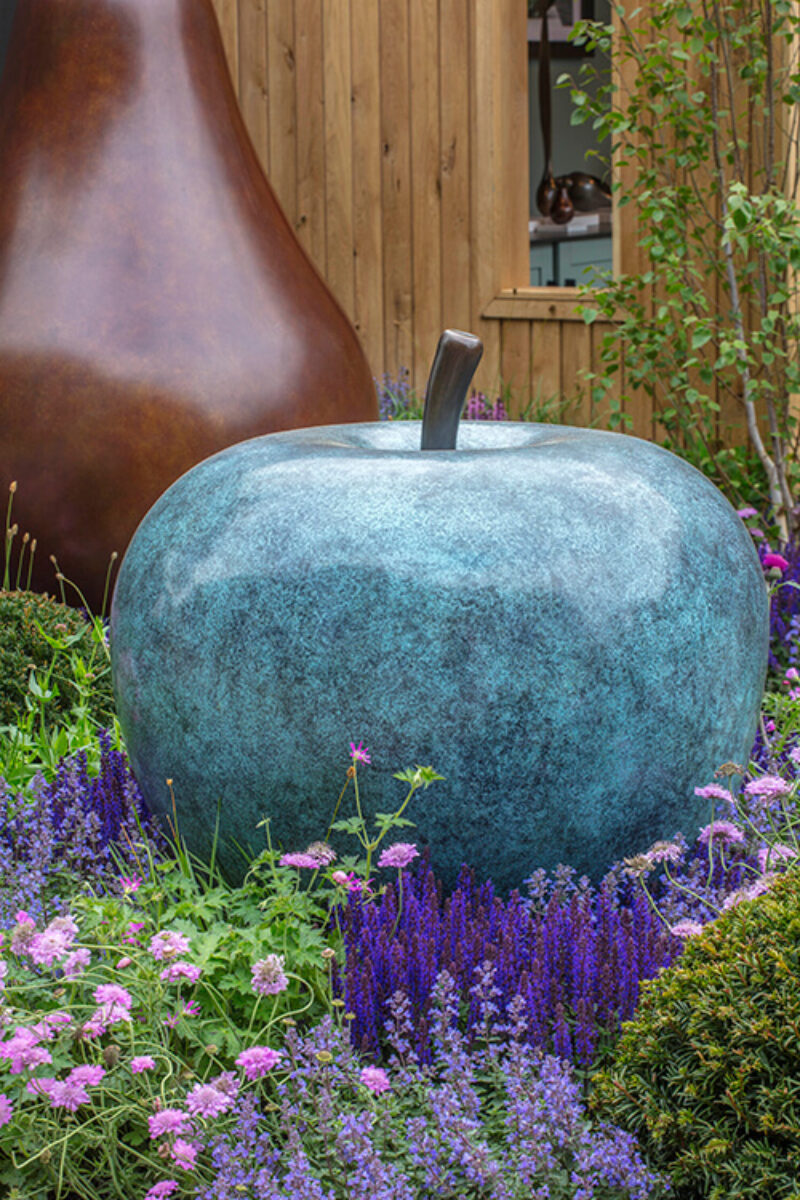 Limited edition bronze apple sculpture with green patina displayed on James Parker’s Main Avenue stand at RHS Chelsea Flower Show.