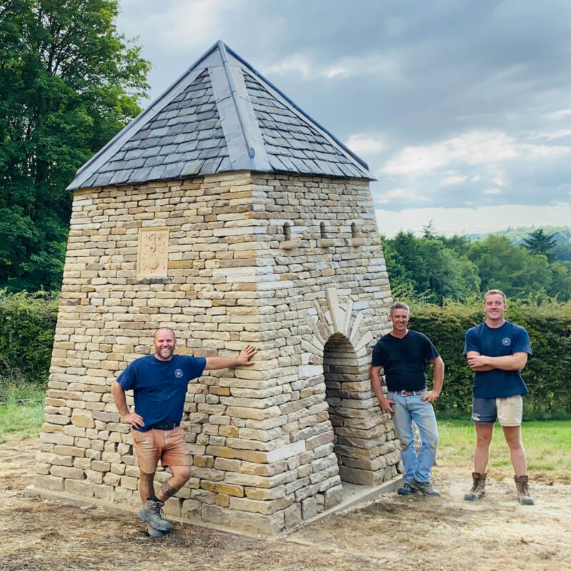 James Parker with Martin Tyler and Finlay Reade beside the completed dry stone doocot at Teasses Estate, Fife.